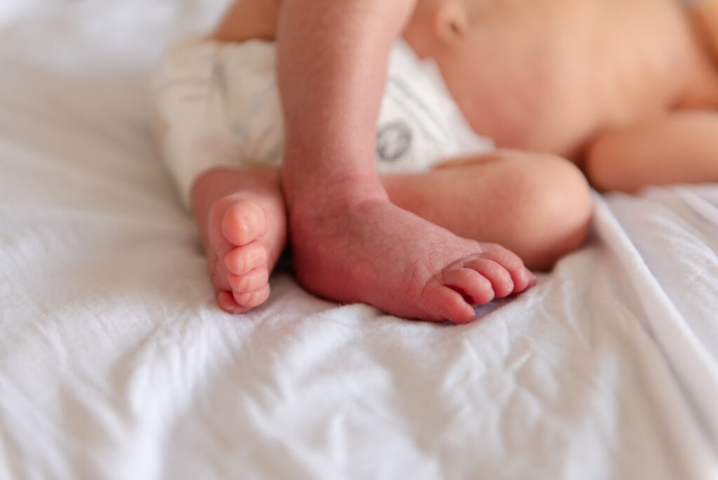 Newborn tiny toes captured during lifestyle newborn session in St. George, Utah.