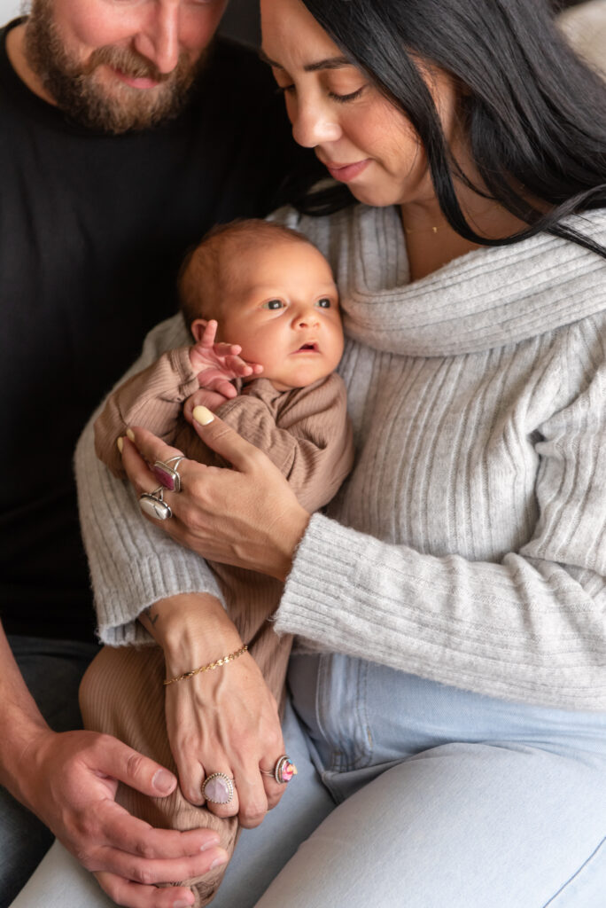 Sweet moment of parents holding newborn baby St. George, Utah