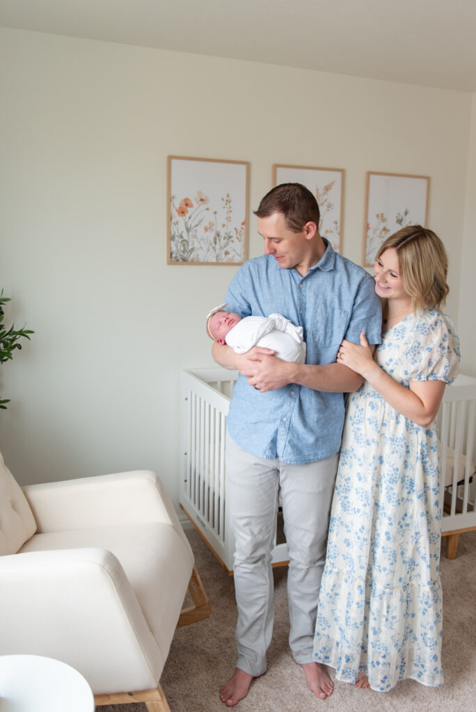 Dad and mom peaceful moment adoring newborn during photos St. George, Utah