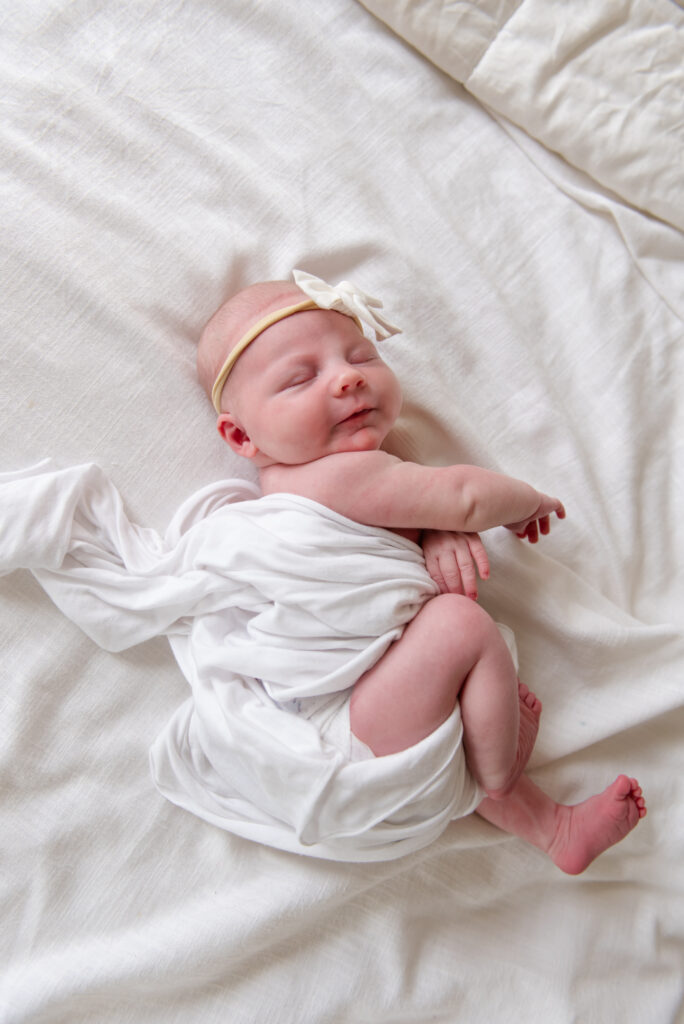 Newborn waking up during lifestyle newborn photos in St. George, Utah