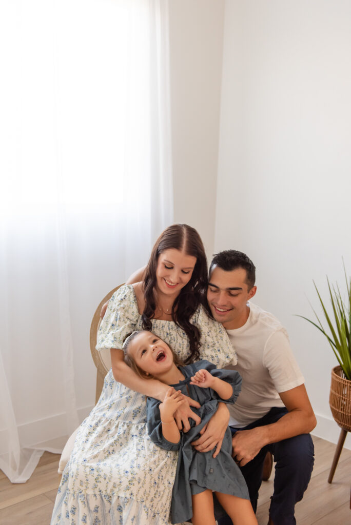 Southern Utah maternity photographer – candid family photos with toddler girl and baby bump