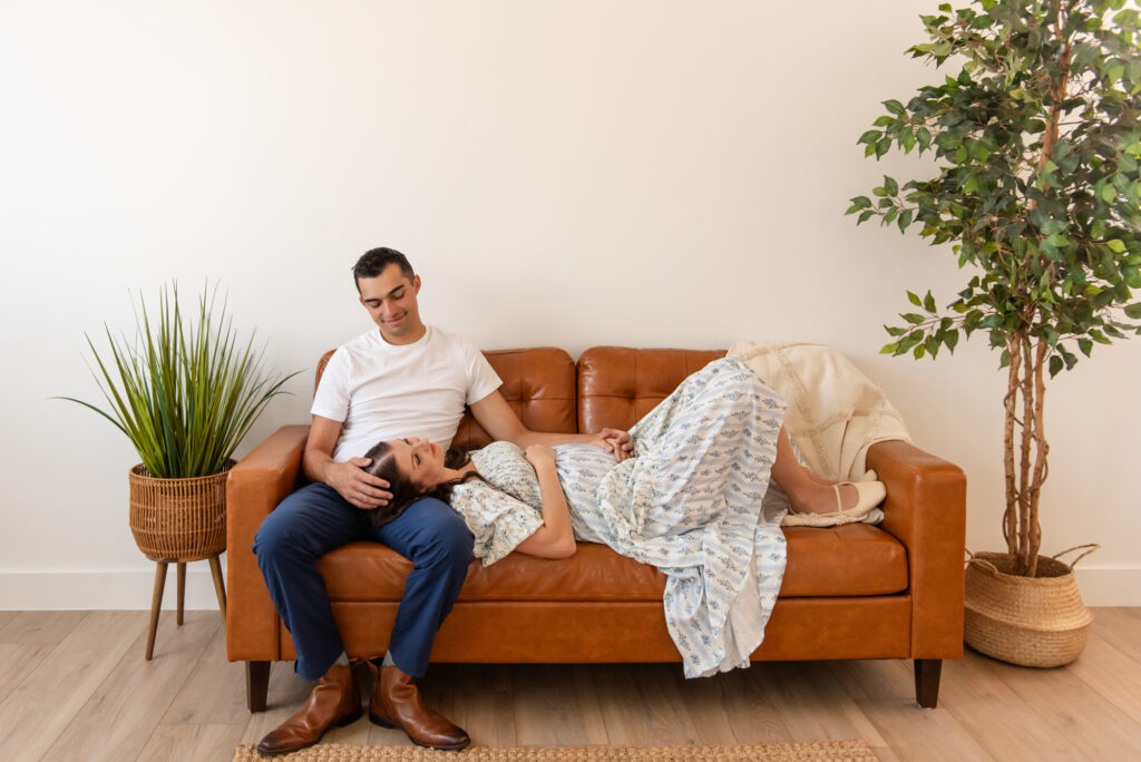 Studio maternity portraits with neutral furniture and dreamy light in Hurricane Utah