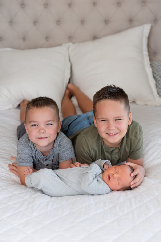 Big brothers with newborn baby brother