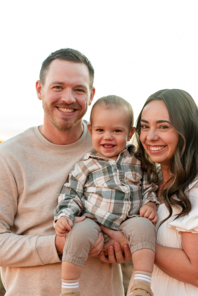 Big smiles family of three