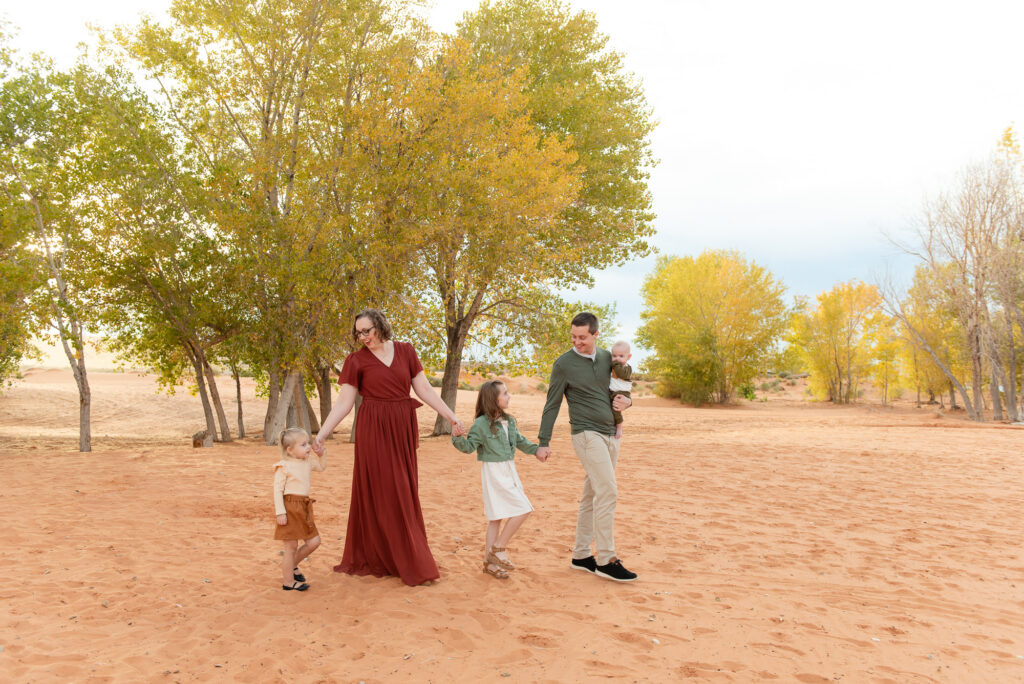 Fall trees at Sand Hollow family walking in sand
