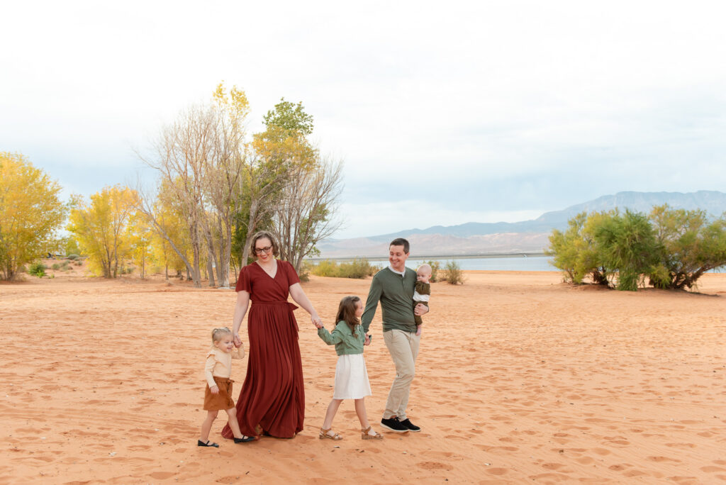 Family walking on sand beach at Sand Hollow State Park