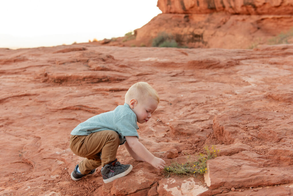 Toddler exploring red rocks pioneer park st george utah