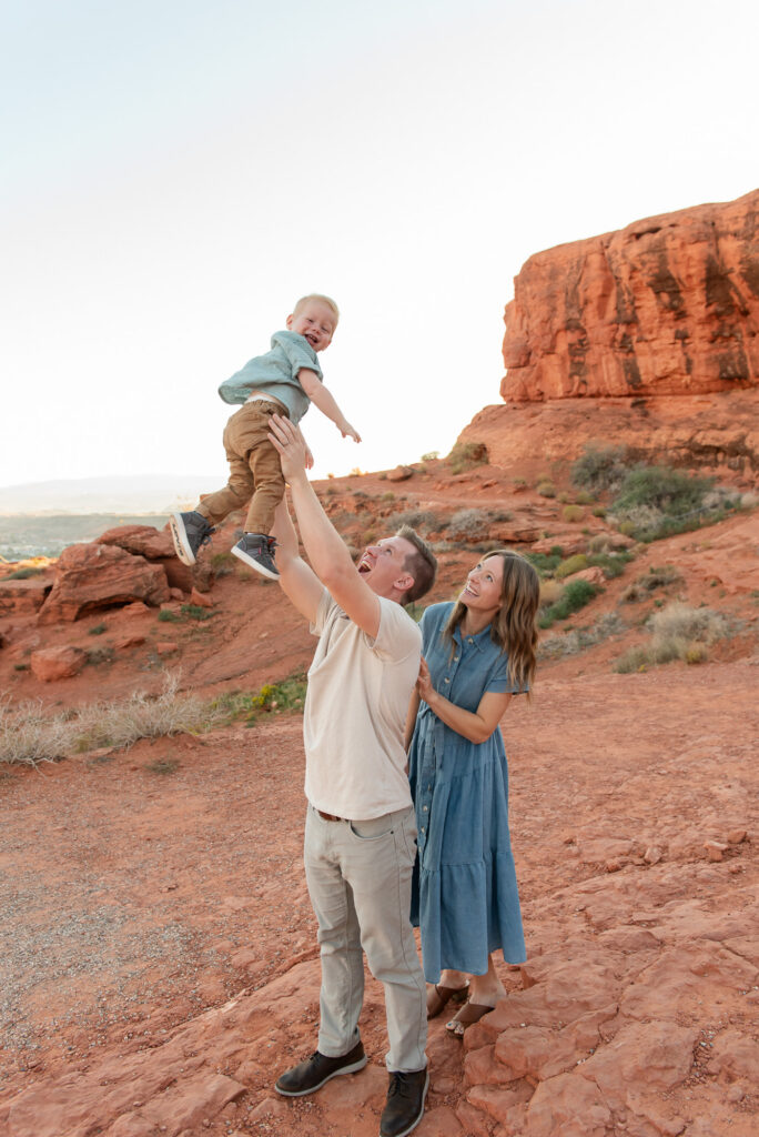 Throwing toddler in air family photos pioneer park st george utah